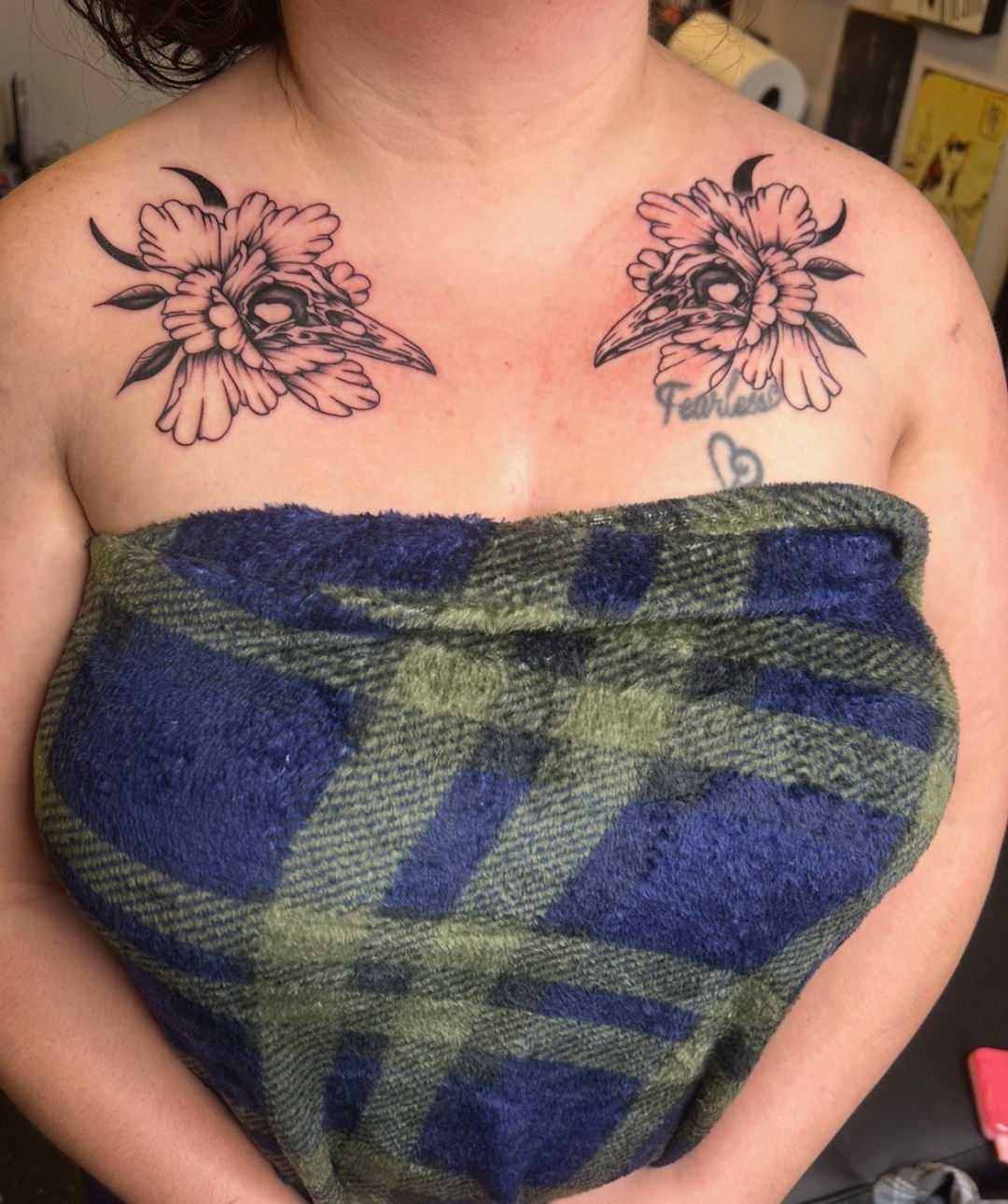 Matching floral skull chest tattoos by CJ Upton