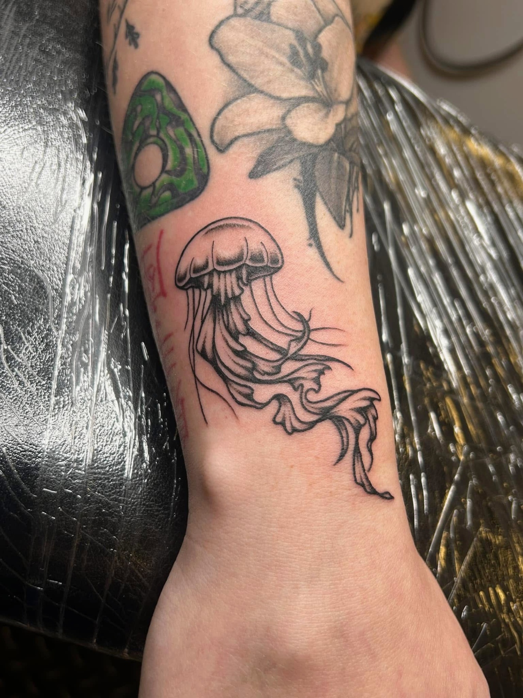 Black and grey jellyfish forearm tattoo by CJ Upton