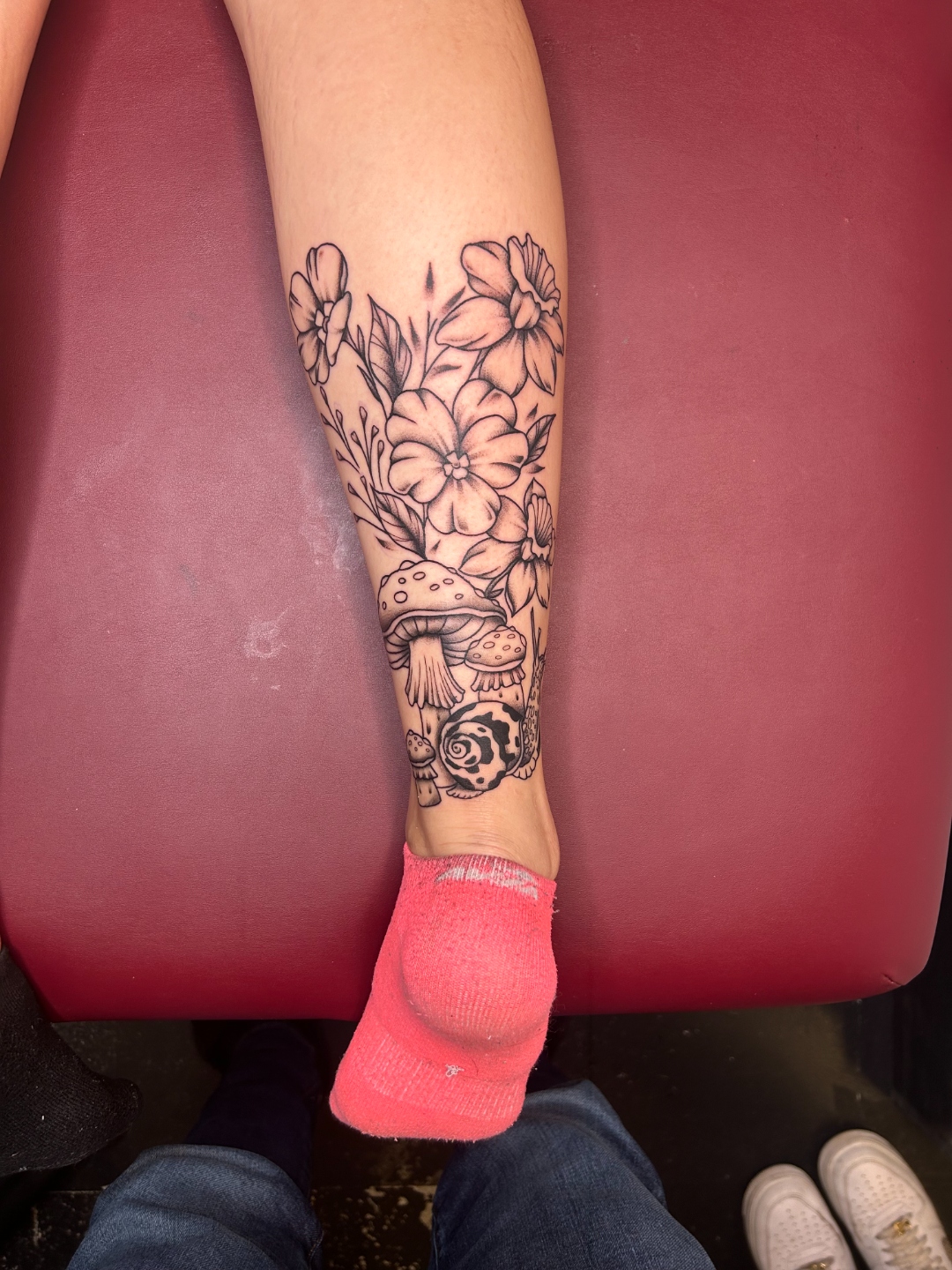 Black and grey mushrooms and flowers calf tattoo by CJ Upton