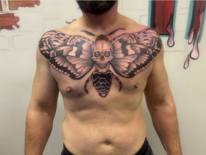 Death moth skull chest plate tattoo by Eric Bryant