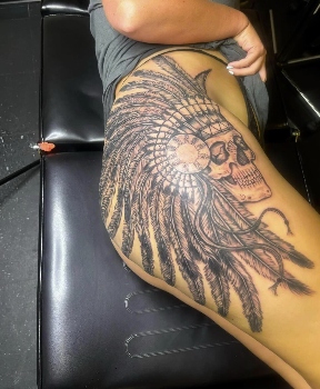 Headdress skull black and grey hip tattoo by Eric Bryant