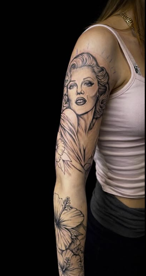 Marilyn Monroe portrait realism half sleeve tattoo by Eric Bryant