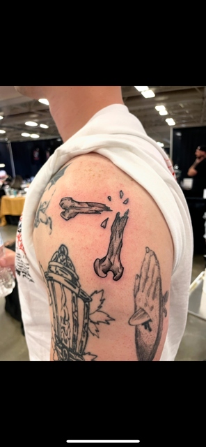 Broken bone shoulder tattoo by Taylor Brown